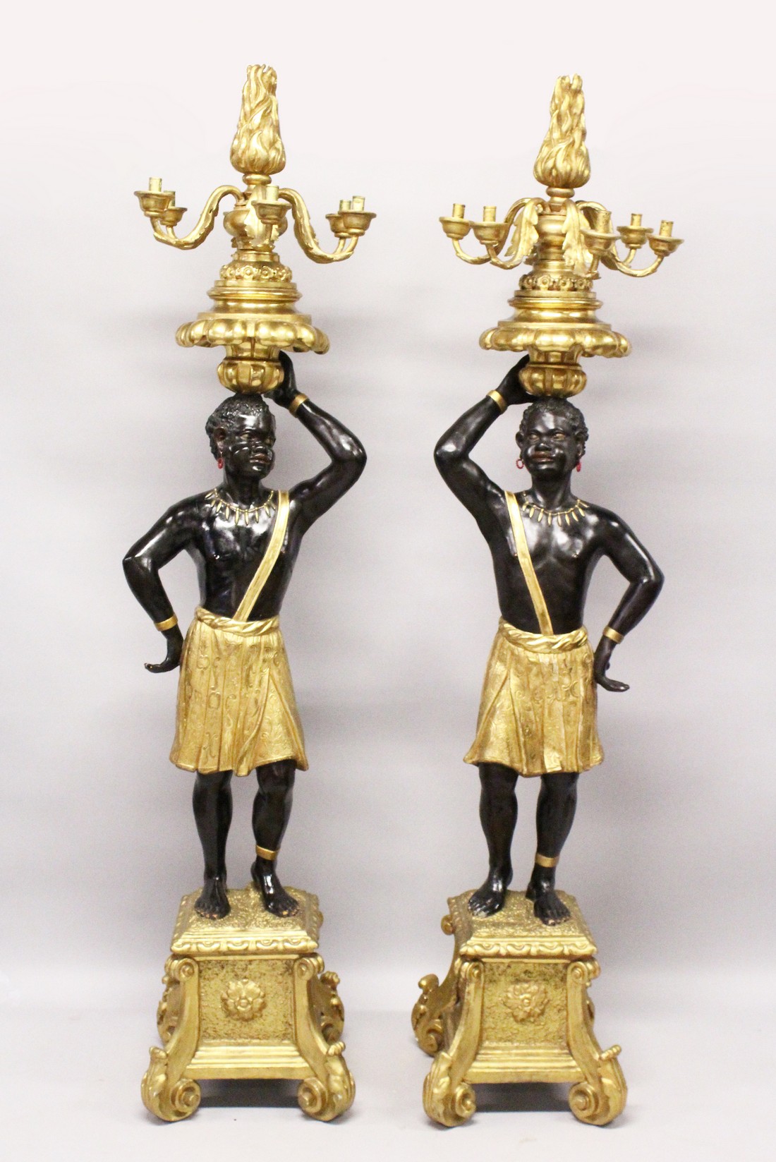 A SUPERB LARGE PAIR OF 19TH CENTURY STANDING NUBILE FIGURE CANDELABRA formed as a a pair of