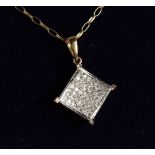 A 9CT GOLD AD DIAMOND PENDANT on a chain.