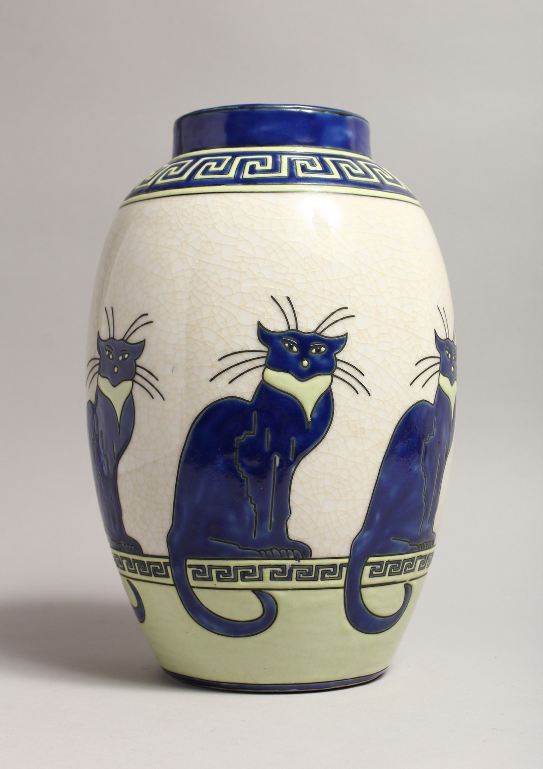 AN ART DECO DESIGN VASE with blue cats.