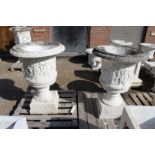 A VERY GOOD PAIR OF ITALIAN CARVED WHITE MARBLE CAMPAGNA URNS ON STANDS 2ft 5in high, stand 2ft