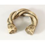 A SEJLUK WHITE METAL TWISTED BANGLE, The lower with a hall mark OR makers mark. 8cm