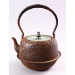 A JAPANESE EDO / MEIJI PERIOD IRON MOULDED BIRD KETTLE & COVER, the iron kettle with side decoration