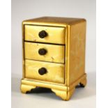 A SMALL JAPANESE GILT LACQUER CHEST, comprising three small drawers, supported on four bracket feet,