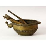 AN EASTERN BRONZE POURING VESSEL, the spout modelled as the head of an elephant, together with a