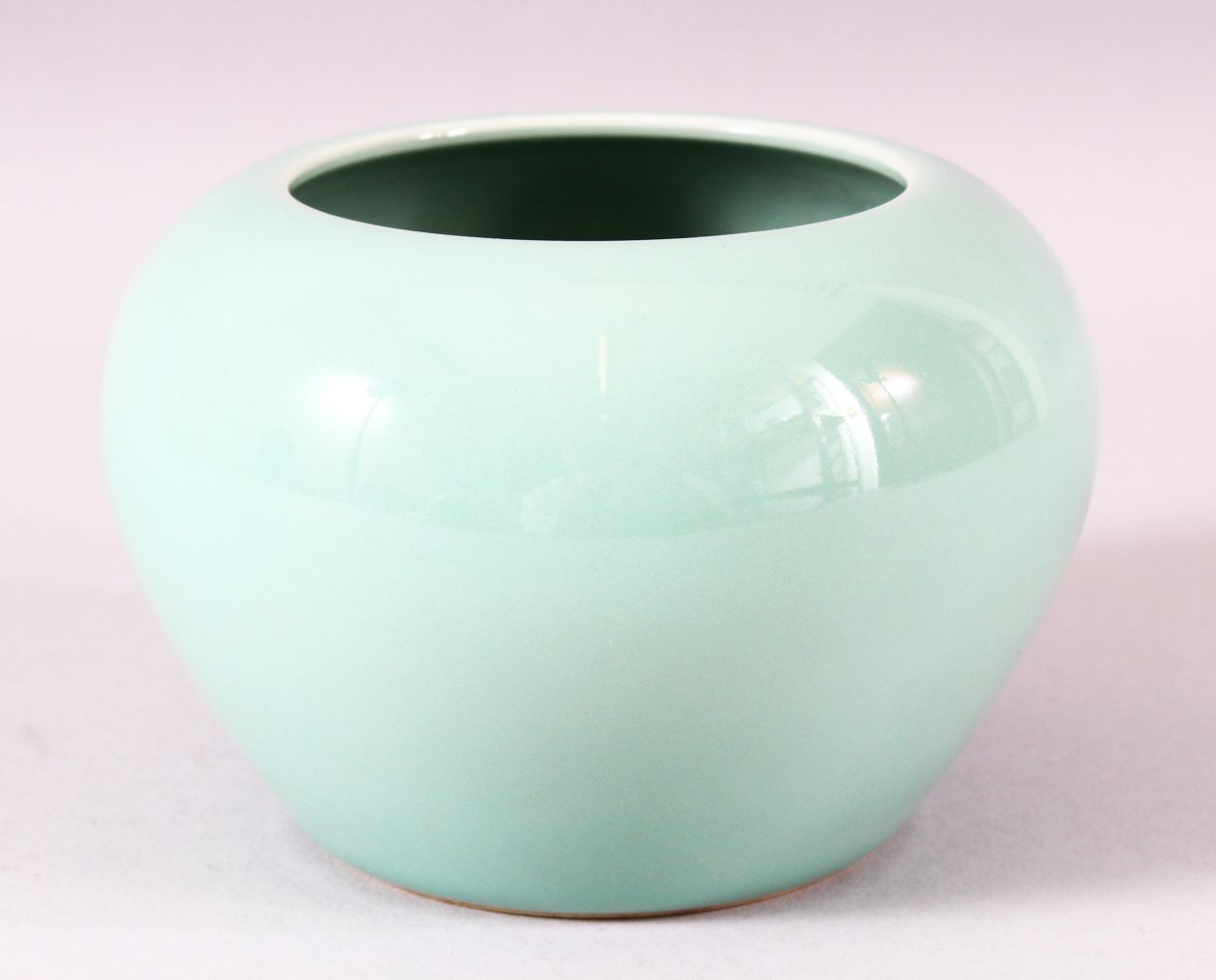 A GOOD CHINESE CELADON GLAZED VASE, the base with blue six character mark, 9.5cm high.