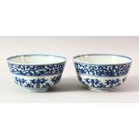 A PAIR OF CHINESE BLUE AND WHITE MING STYLE PORCELAIN RICE BOWLS, 13cm diameter.
