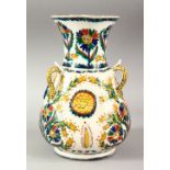 A TURKISH OTTOMAN KUTAHYA POTTERY MOSQUE LAMP - with triple handles and raised flora, with floral