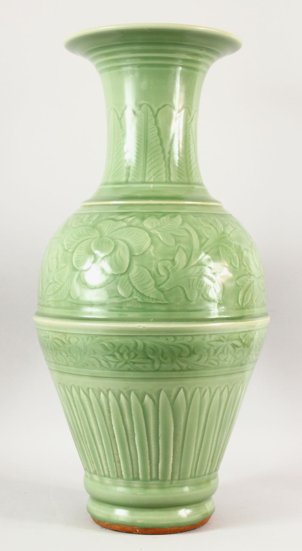 A VERY GOOD LARGE CHINESE CELADON VASE, with panels of flowers and fluted base, 64cm high.