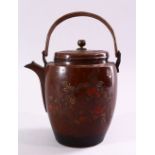 A JAPANESE MEIJI / TAISHO PERIOD FLORAL TEAPOT & COVER, with carved decoration depicting native