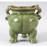 A GOOD CHINESE CRACKLE GLAZE CELADON TRIPOD CENSER, the handles formed as dragons, 15.5cm high.