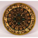 A GOOD PERSIAN POTTERY PLATE - decorated with formal floral motif with borders of calligraphy, 27cm