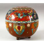 A CHINESE CLOISONNE JAR AND COVER, decorated with phoenix and floral motifs, supported on three