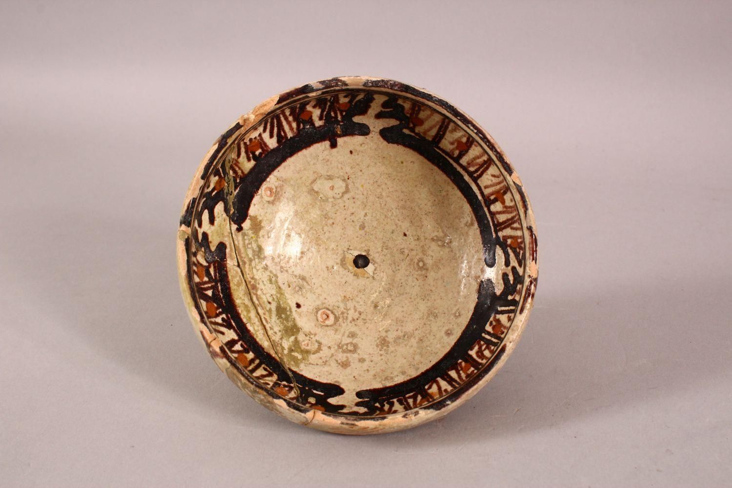 AN EARLY PERSIAN NISHAPUR POTTERY BOWL, possibly 10th Century, 12cm diameter. - Image 2 of 4