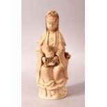 A CHINESE BLANC DE CHINE FIGURE OF GUANYIN AND CHILD - seated with young in her arms, seated upon