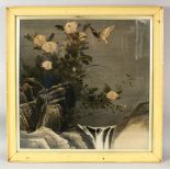 AN EARLY 20TH CENTURY JAPANESE PAINTING ON TEXTILE, depicting birds and flowers by a waterfall,
