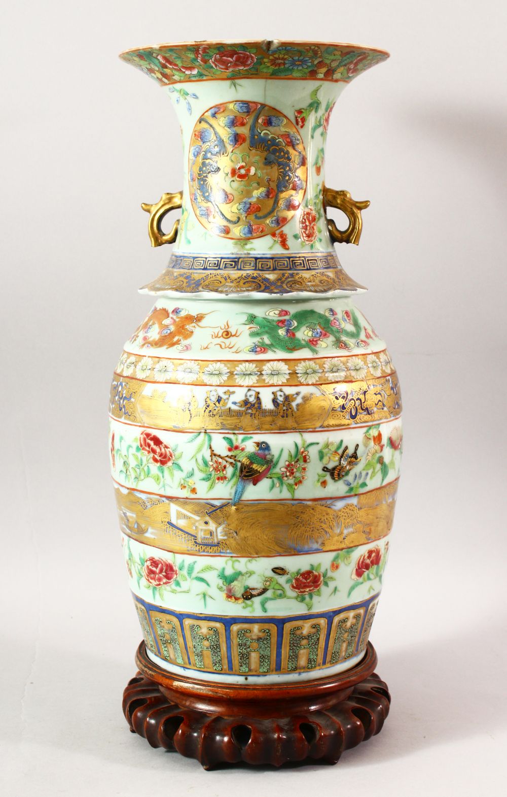 A LARGE CHINESE TWIN HANDLE CELADON GROUND ENAMELLED VASE AND STAND, the body painted with various