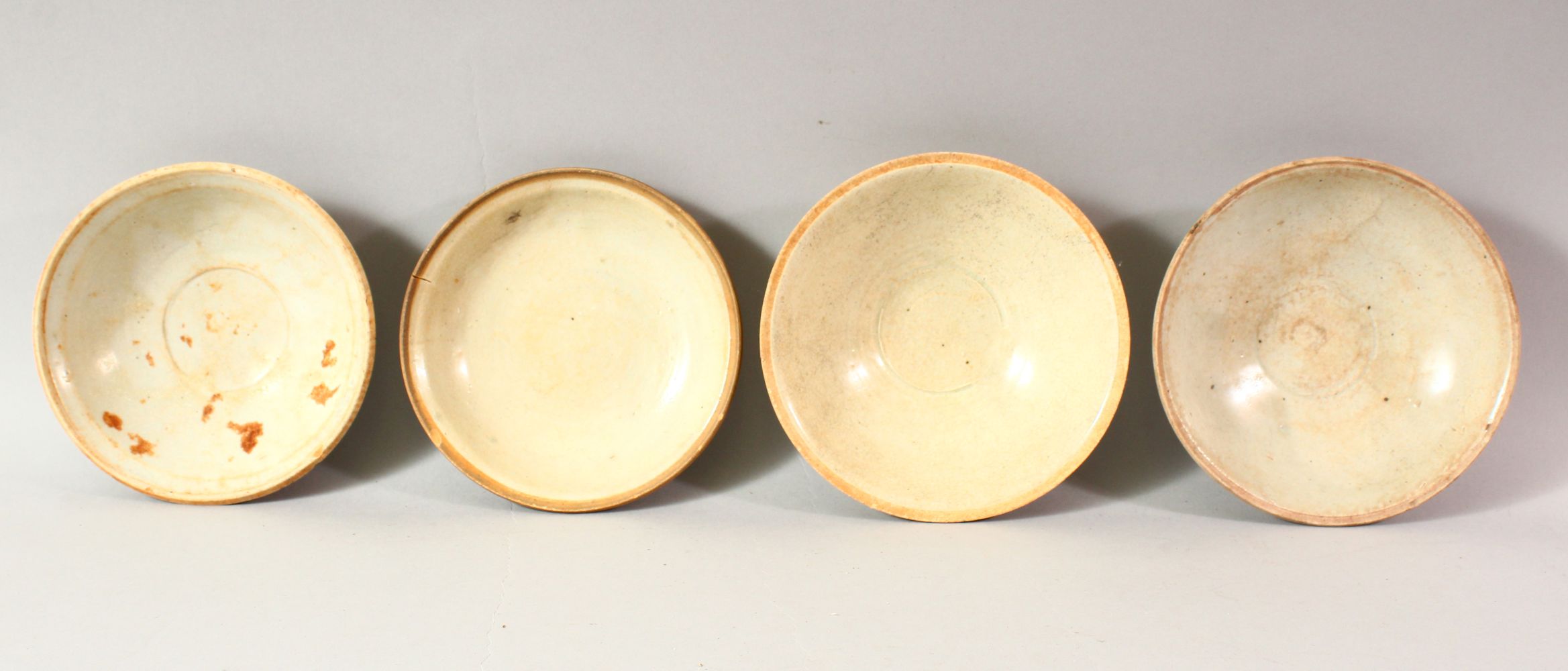 FOUR CHINESE TERRACOTTA BOWLS, various sizes, approx. 16cm diameter.