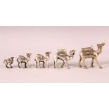 A GROUP OF 5 925 MARKED SILVER COLOURED TURKISH GRADUATED CAMEL FIGURES, the larger with a more