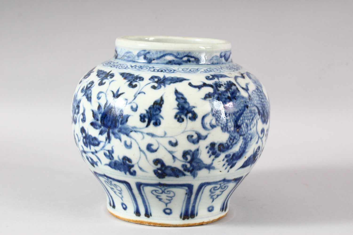 A CHINESE BLUE AND WHITE GLAZED POTTERY VASE, the body painted with kylin and stylised flora, 15.5cm - Image 4 of 6