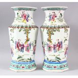 A PAIR OF CHINESE FAMILLE ROSE PORCELAIN HEXAGONAL PORCELAIN VASES - each vase of hexagonal form,