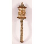 A 19TH CENTURY TIBETAN CARVED BONE AND WHITE METAL PRAYER WHEEL - with carved bone core with