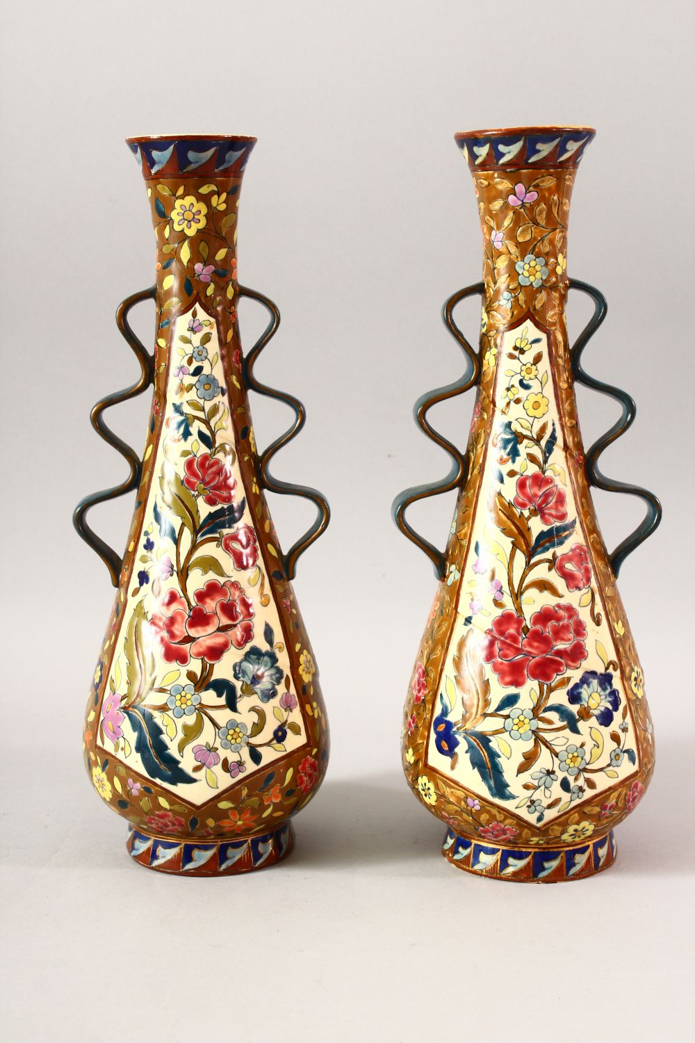 A PAIR OF IZNIK STYLE TAPERING VASES, with wavy handles, 36cm high. - Image 2 of 4