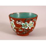 A CHINESE YIXING CLAY TEA BOWL - the exterior enameled with birds and flora - the interior with a
