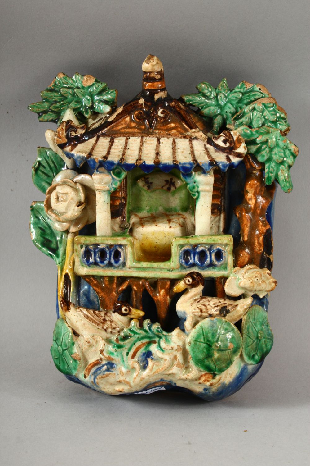 TWO CHINESE POLYCHROME POTTERY WALL POCKETS, carved with a shrine and flora with ducks / birds, 20cm - Image 4 of 7