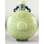 A LARGE CHINESE CELADON GLAZED MOONFLASK, with moulded panels depicting lucky symbols, 50cm high.