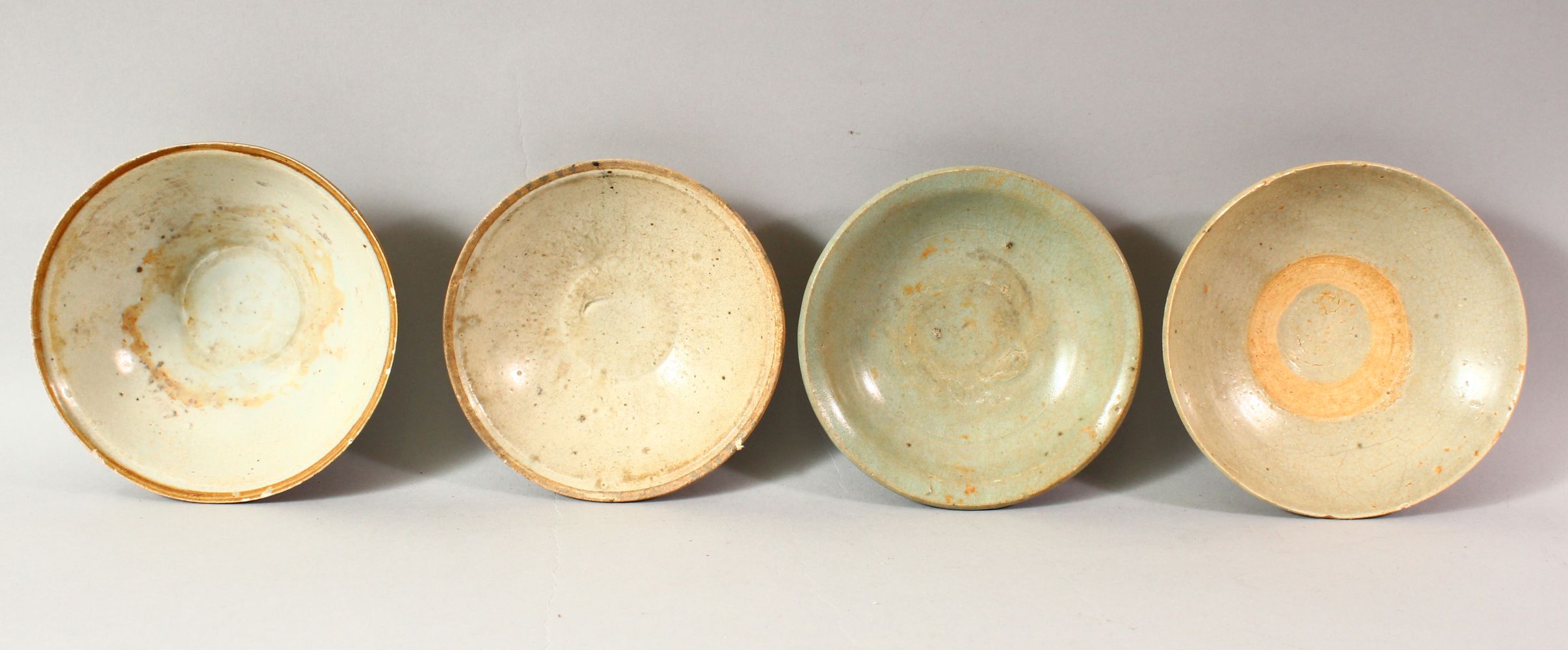 FOUR CHINESE TERRACOTTA BOWLS, various sizes, approx. 16cm diameter.