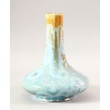 AN UNUSUAL GLAZED CERAMIC VASE, 22cm high.