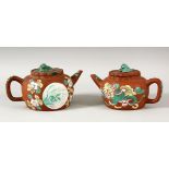 TWO CHINESE YIXING CLAY TEAPOTS WITH POLY CHROME DECORATION- the pots decorated depicting panels