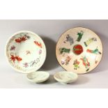 TWO CHINESE PORCELAIN BOWLS, one decorated with fish, the other with figures, (both af), together