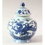 A CHINESE BLUE AND WHITE PORCELAIN GINGER JAR AND COVER, decorated with dragon and lotus, overall