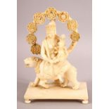 A FINE 19TH CENTURY CARVED IVORY FIGURE OF GODDESS PARVATI HOLDING GANESH, sat upon a lion on a