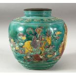 A CHINESE TURQUOISE GLAZED FAHUA STYLE VASE, the body decorated with a sage with another figure