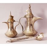 TWO INDIAN DALLAH WHITE METAL COFFEE POTS & LADLE - The ladle possibly with a silver handle,