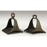 A MATCHED PAIR OF 18TH/19TH CENTURY PERSIAN OR OTTOMAN STEEL STIRRUPS, inset with turquoise beads.