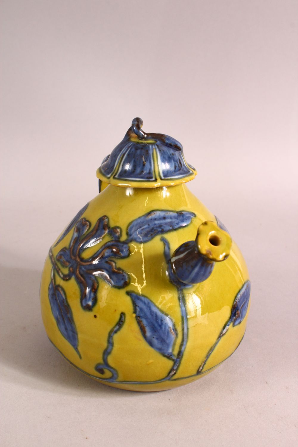 A CHINESE YELLOW GROUND GLAZED POTTERY TEAPOT AND COVER, the body with blue floral decoration, - Image 2 of 6