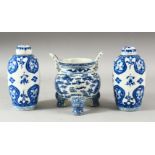 A CHINESE BLUE AND WHITE PORCELAIN TRIPOD CENSER, decorated with two dragons and the flaming pearl