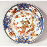 A 19TH CENTURY CHINESE PORCELAIN PLATE, decorated in the imari palette, the centre depicting a man