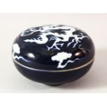 A CHINESE BLUE GLAZED PORCELAIN DRAGON BOX AND COVER, 13.5cm diameter.