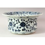 A LARGE CHINESE BLUE AND WHITE WASH POT, profusely decorated with lotus flowers, 32cm diameter.