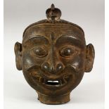 A LARGE 17TH/18TH CENTURY INDIAN BRONZE SHIVA MASK, 22cm.