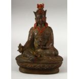 A CHINESE BRONZE BUDDHA, with traces of original paint, 19cm high.