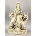 A CHINESE DEHUA PORCELAIN GUANYIN FIGURE - depicting the goddess riding upon the back of kylin,