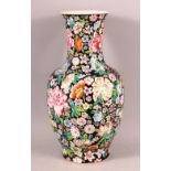 A CHINESE FAMILLE ROSE MILLEFLUER STYLE PORCELAIN VASE, decorated upon a black ground with profuse