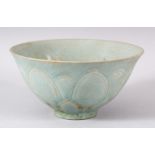 A CHINESE CELADON BOWL, POSSIBLY 19TH CENTURY, with moulded petal decoration, 14.5cm diameter.
