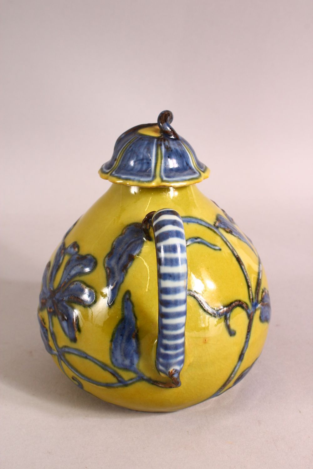 A CHINESE YELLOW GROUND GLAZED POTTERY TEAPOT AND COVER, the body with blue floral decoration, - Image 4 of 6