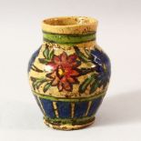 A SMALL ISLAMIC STYLE GLAZED POTTERY VASE, 12.5cm high.